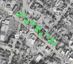 An aerial map of downtown Grimsby, Ontario as seen on the Grimsby Timescapes app. Each green pin represents a site on Main Street. When users select a pin, historic photographs of that site pop up on their device.